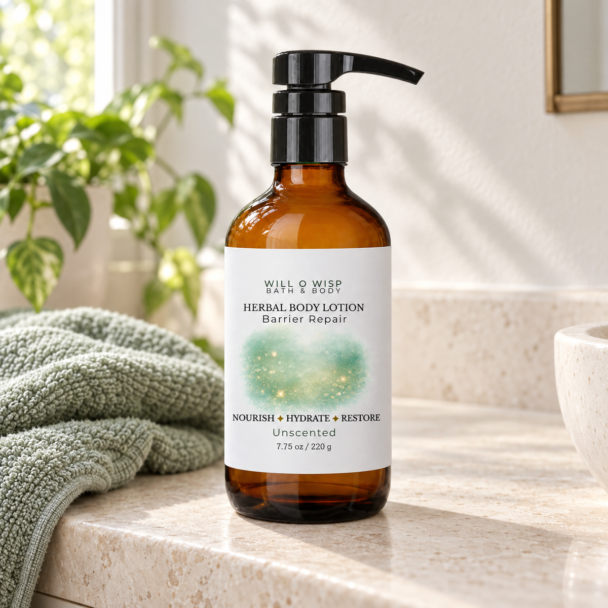 WILL O WISP BATH & BODY herbal body lotion in an amber glass pump bottle on a bathroom counter with a green towel.