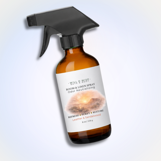 WILL O WISP BATH & BODY amber glass bottle of leather and sandalwood room and linen spray with a black trigger sprayer