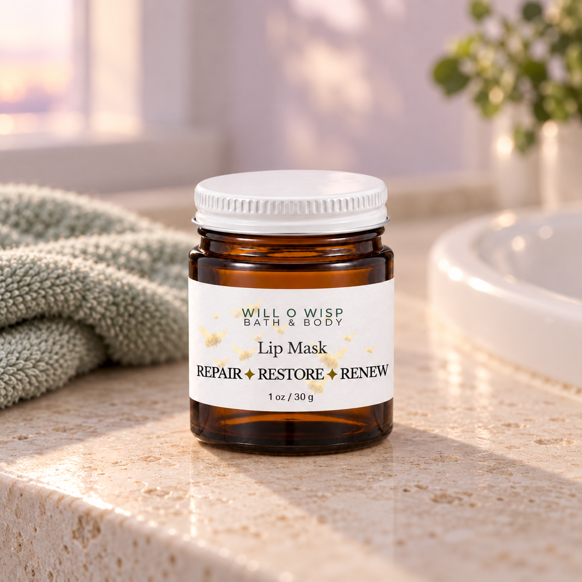 WILL O WISP BATH & BODY nourishing lip mask in an amber glass jar with a white lid on a bathroom vanity counter.