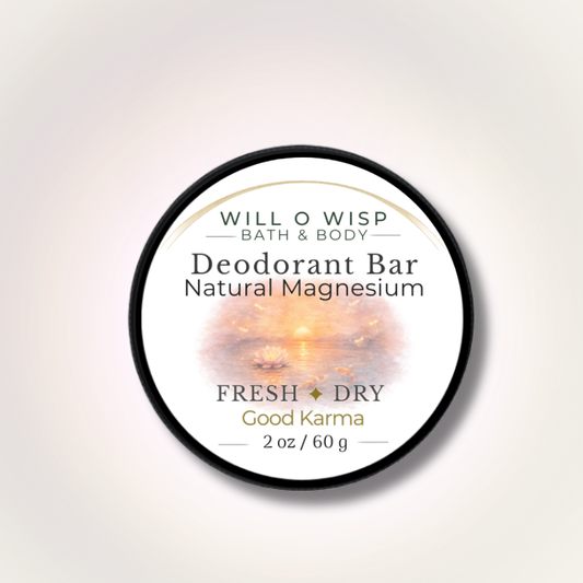 WILL O WISP BATH & BODY Good Karma natural magnesium deodorant bar in a round black tin with a sunset lotus label.