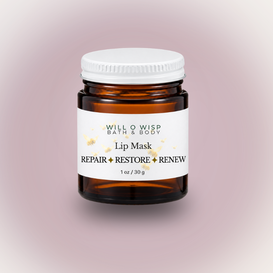 WILL O WISP BATH & BODY nourishing lip mask in a small amber glass jar with a white lid on a soft pink background