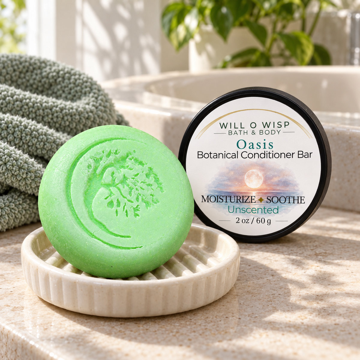 WILL O WISP BATH & BODY Oasis botanical conditioner bar in a ceramic dish next to its label on a sunny bathroom counter